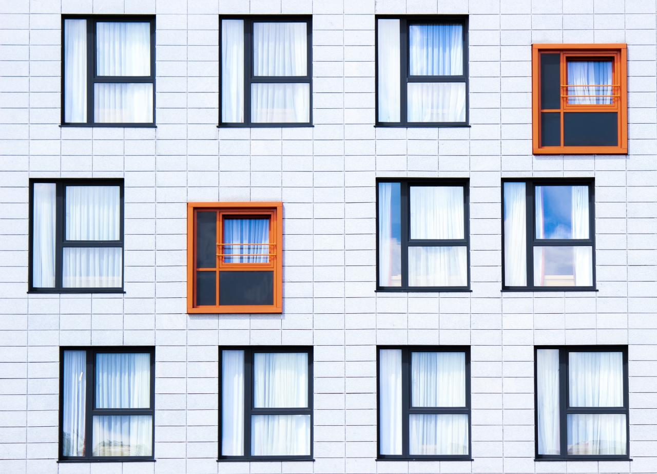 Several windows on the side of a building